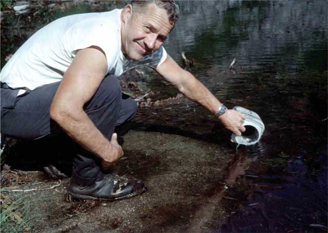 Gene, placing fry into lake.